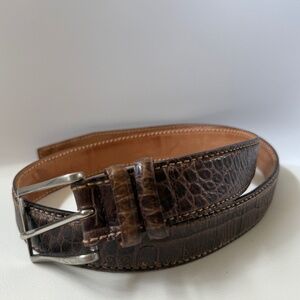 Crocodile or alligator-embossed brown leather belt